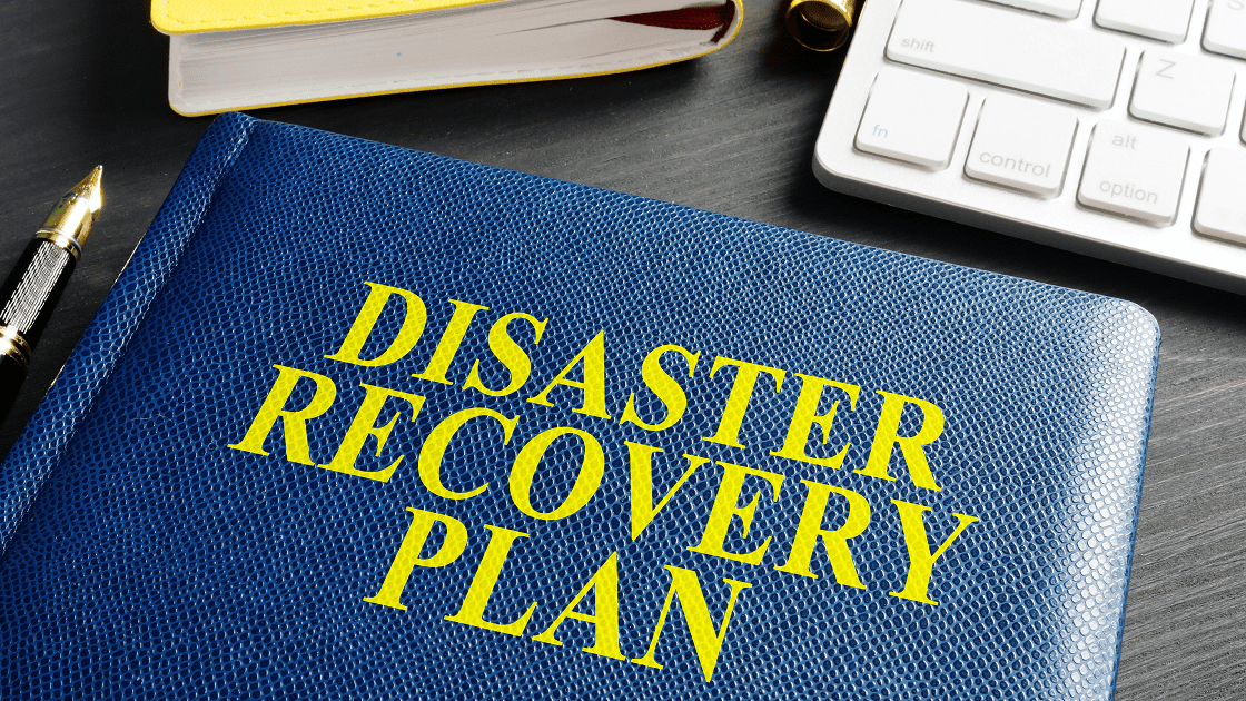 Blue disaster recovery plan book on desk