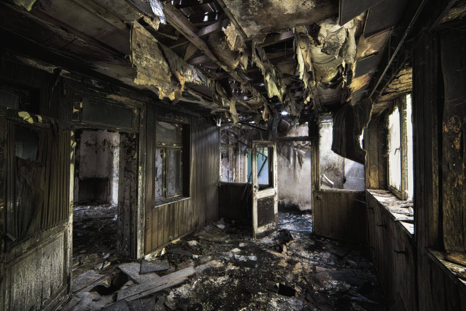 Burned, decaying room with collapsed ceiling
